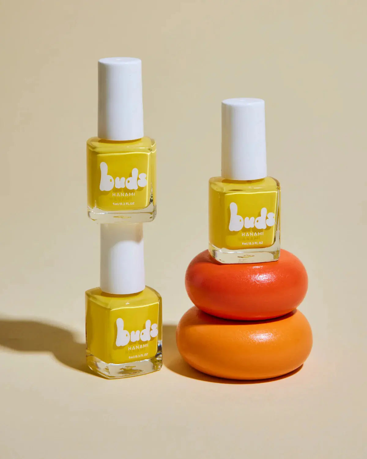 Hanami buds kids nail polish, styled bottles in sunny yellow