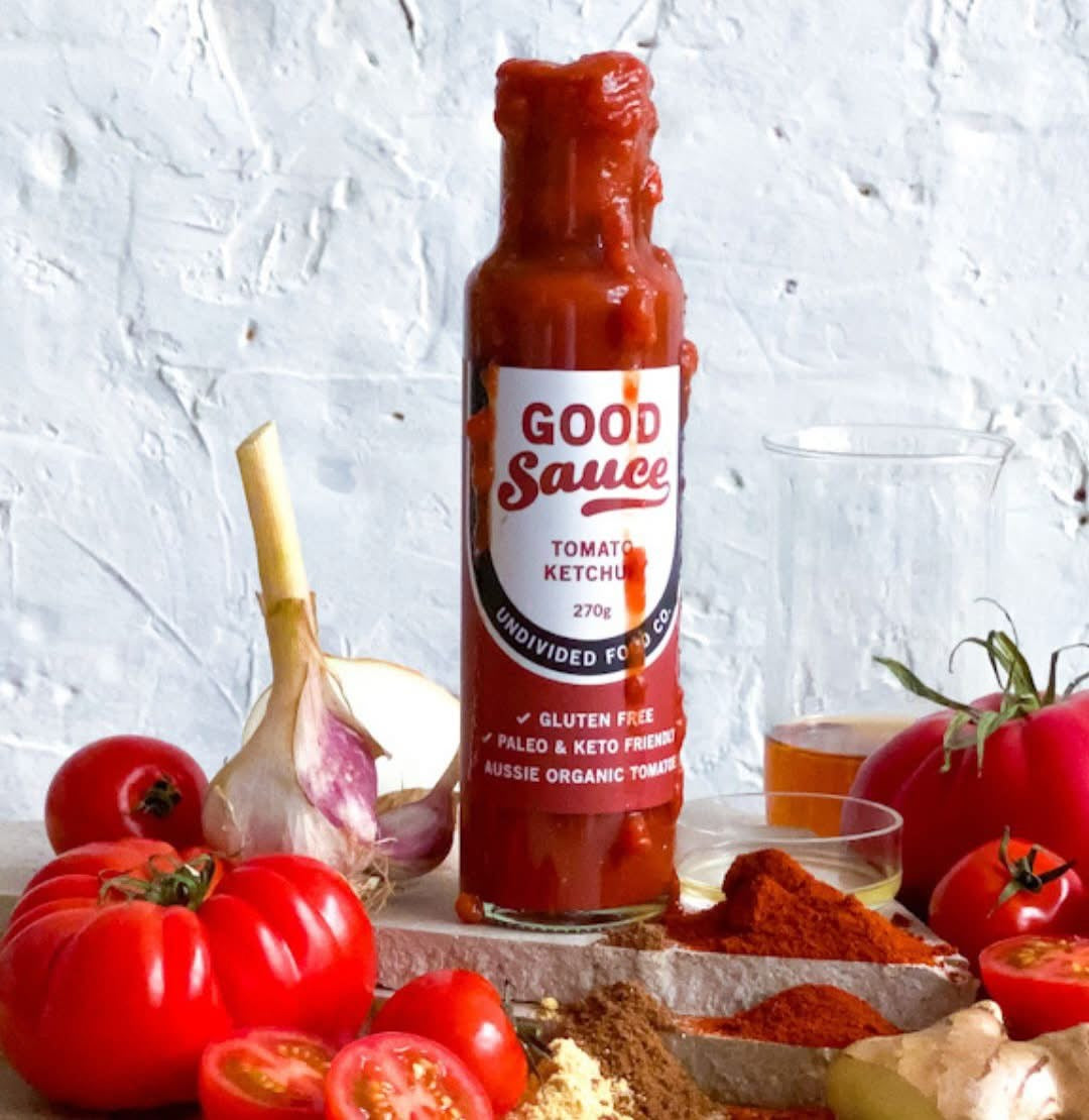 Bottle of 'Good Sauce' bu undivided food companytomato ketchup with tomatoes and spices on a white background