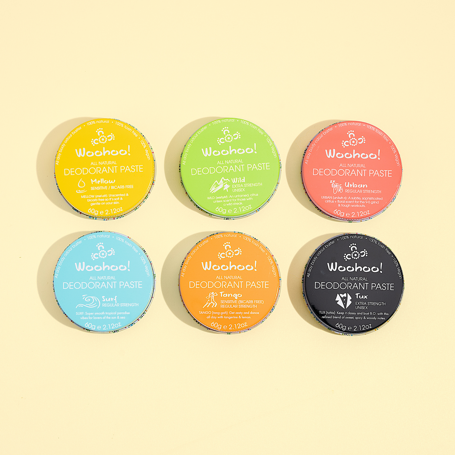 Set of six colorful deodorant paste containers with 'Woohoo!' branding on a light yellow background.