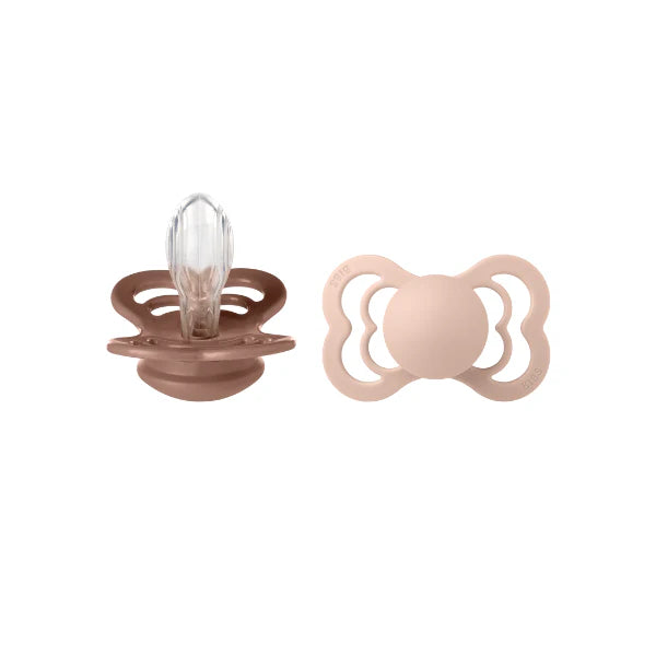 bibs supreme baby pacifiers, woodchuck and blush, on a white background.