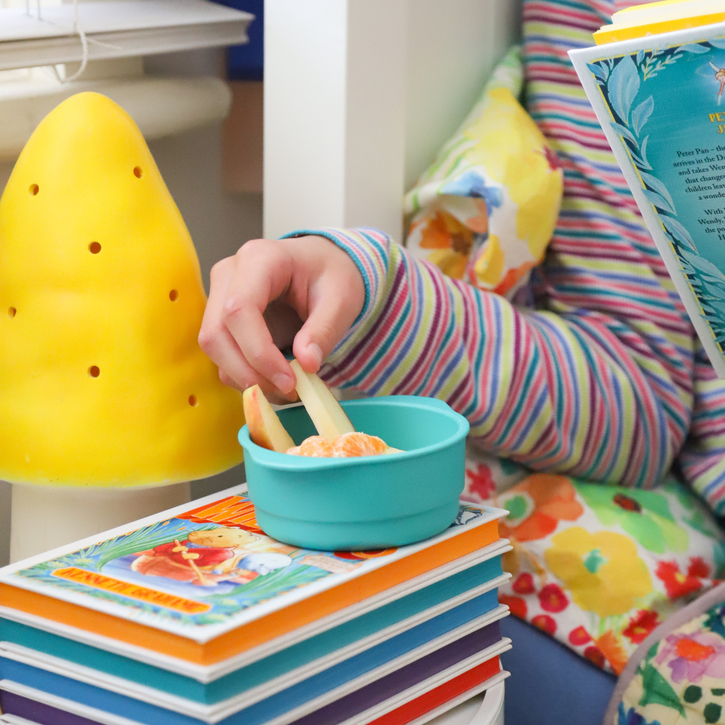 bobo and boo green snack bowl in use with a child