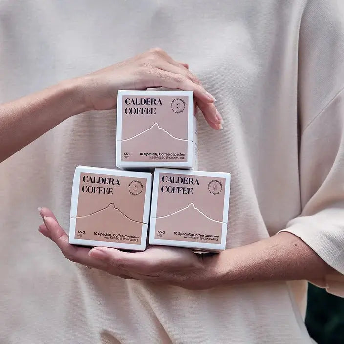 styled image of caldera coffee home compostable coffee capsules