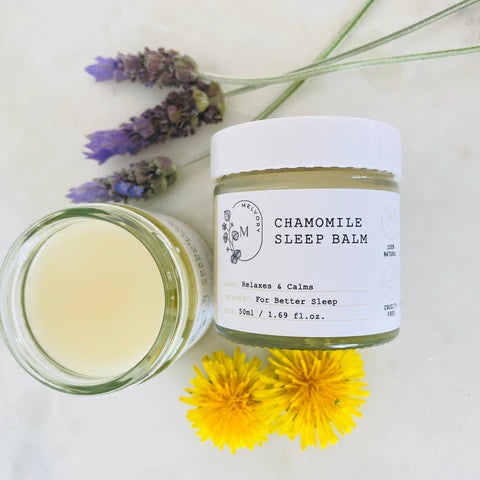 Melvory skincare Chamomile sleep balm jar with flowers on a light background