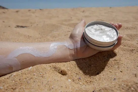 sunbutter sunscreen tin opened on beach
