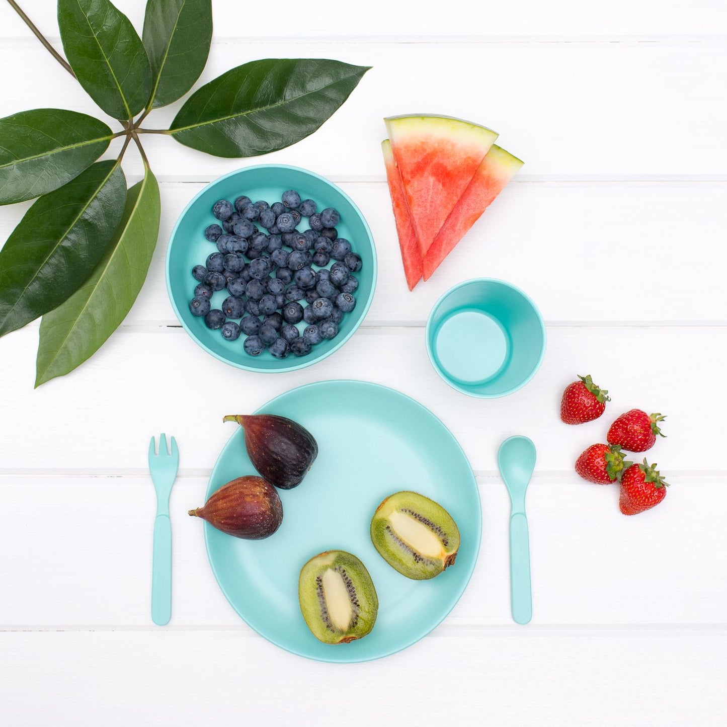 Bobo & Boo's mint Bamboo Dinnerware Set, showcasing a stylish and eco-friendly dining arrangement. The non-toxic bamboo dinnerware adds a touch of elegance to the table, emphasising sustainability