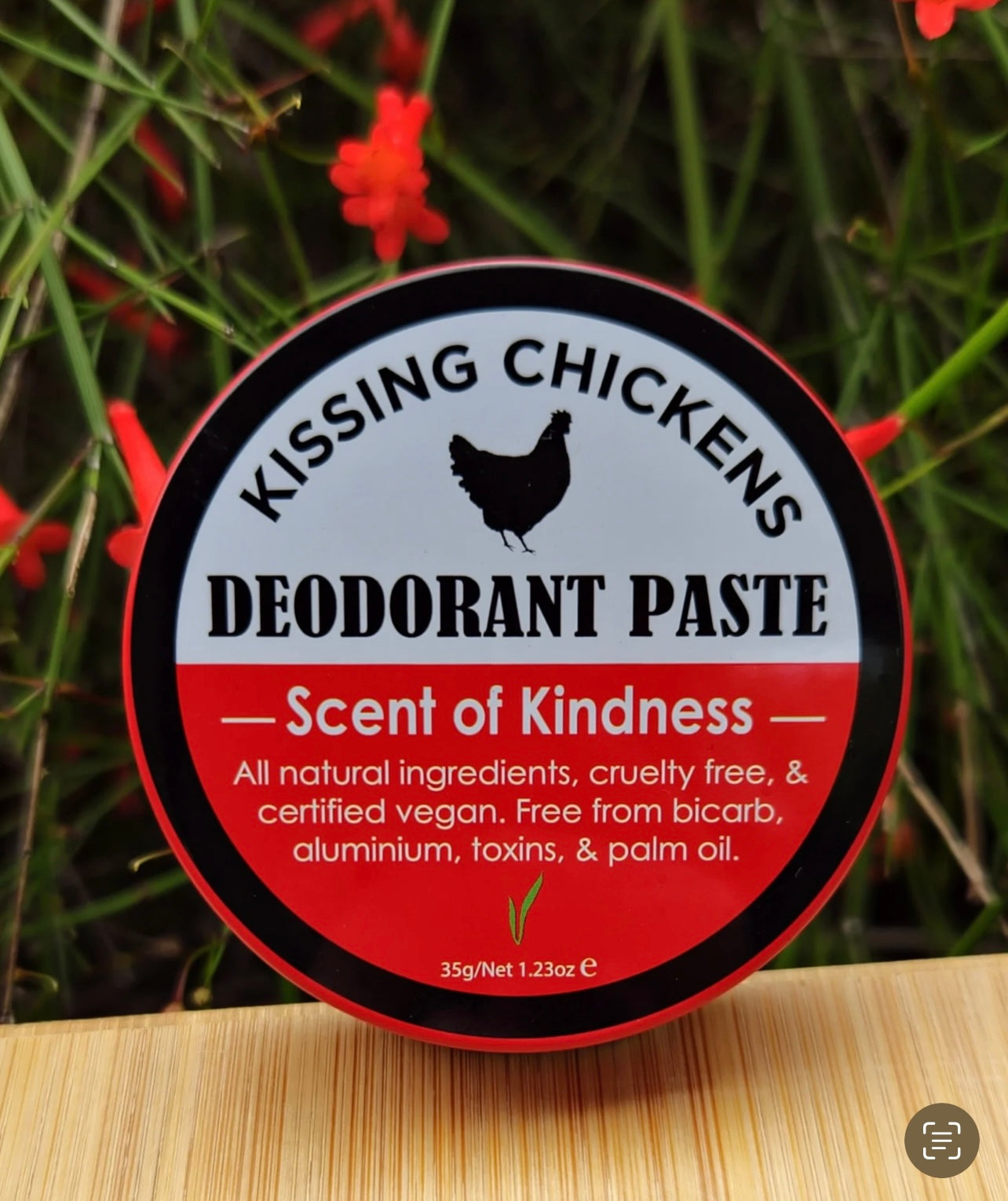 kissing chickens scent of kindness tin with flower background