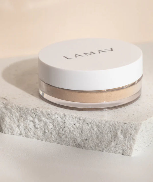 LAMAV powder product container on a textured surface with a neutral background