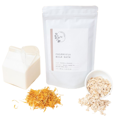 Melvory Calendula milk bath package with dried marigold flowers, and oats on a transparent background.