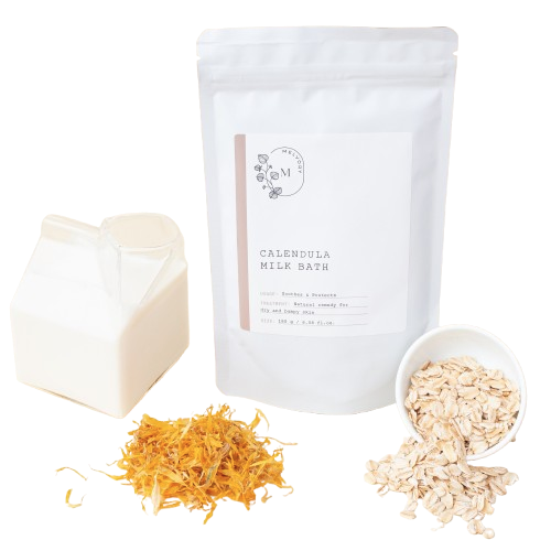 Melvory Calendula milk bath package with dried marigold flowers, and oats on a transparent background.