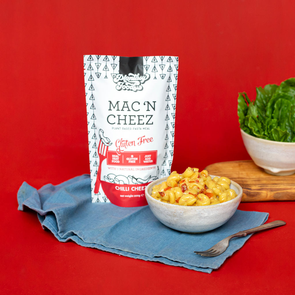 Plantasy foods mac n cheez chilli cheez packet with bowl of pasta, plant based pasta meal