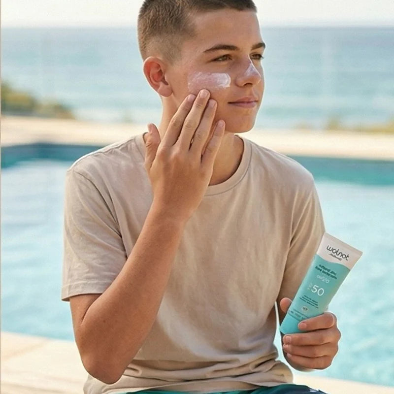 erson applying wotnot natural face sunscreen