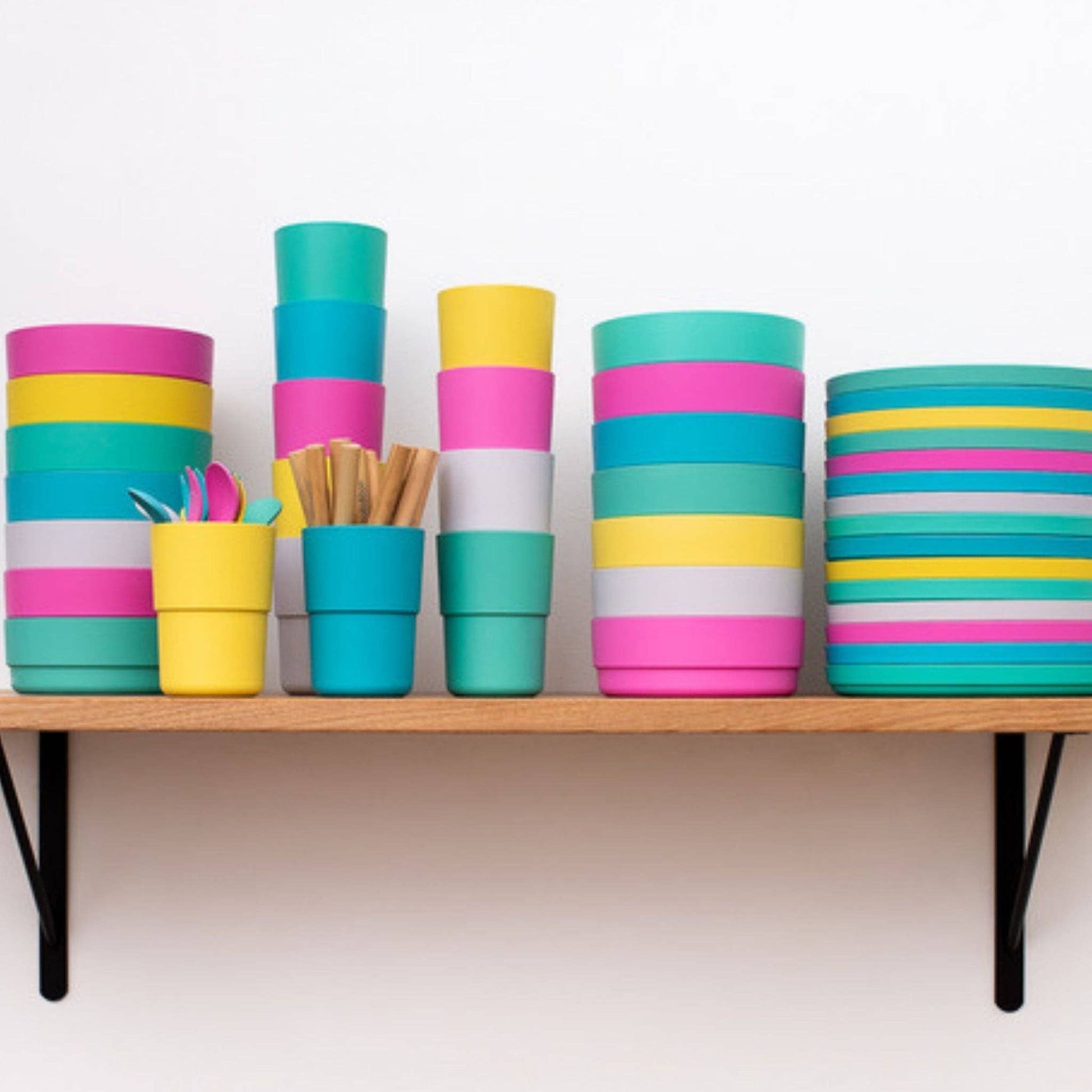 bobo&boo Colorful stacked range on a wooden shelf against a white background