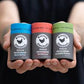 kissing chicken natural deodorant sticks in black spruce, sandalwood and australian kunzea being held in hands
