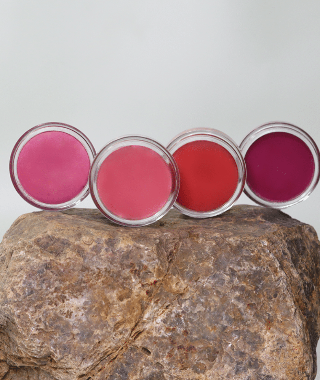 MG Naturals Lip and Cheek Tint colour range displayed on a rock