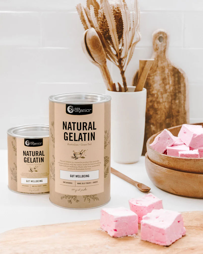 nutra organics natural gelatin powder vannisters displayed with pink marshmellows