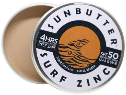 Sunbutter Surf Zinc sunscreen paste in a metal tin with a white lid.